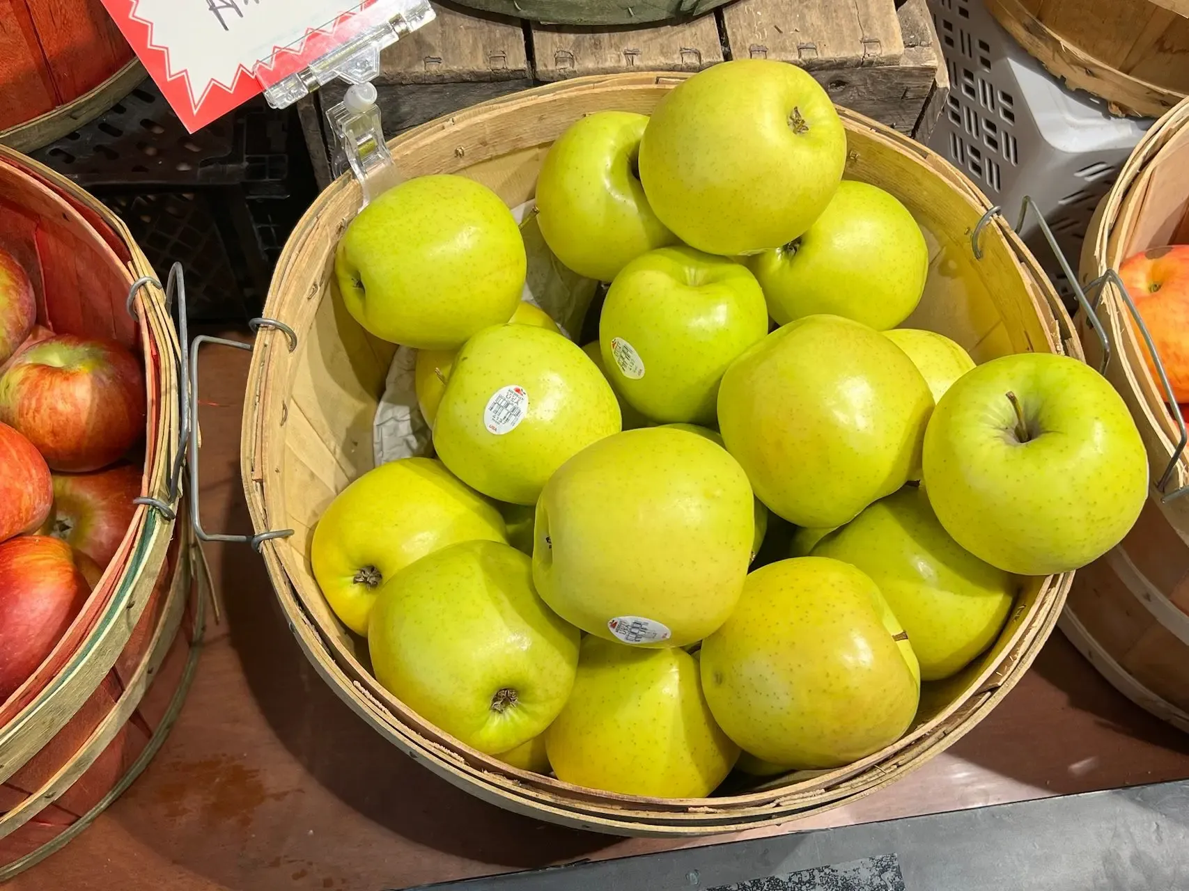 a barrel full of golden delicious apples